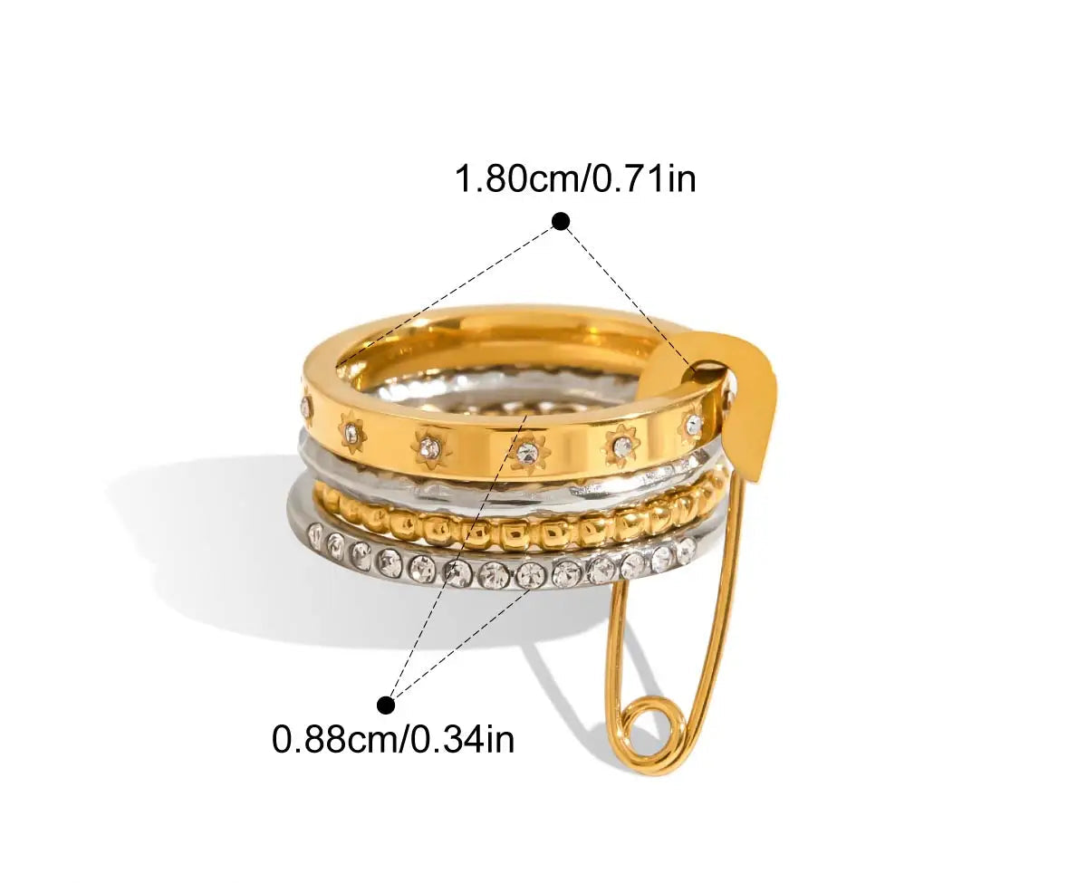 Eine grafische Darstellung eines mehrlagigen Rings mit glatten goldenen und silbernen Bändern und einem goldenen Sicherheitsnadel-Verschluss. Die Maße sind ebenfalls angegeben mit 1,8 cm Innendurchmesser und 0,88 cm Breite