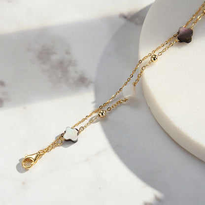 Doppeltes Gliederarmband aus 14K Gold vergoldetem 925er Sterling Silber mit Kleeblättern.