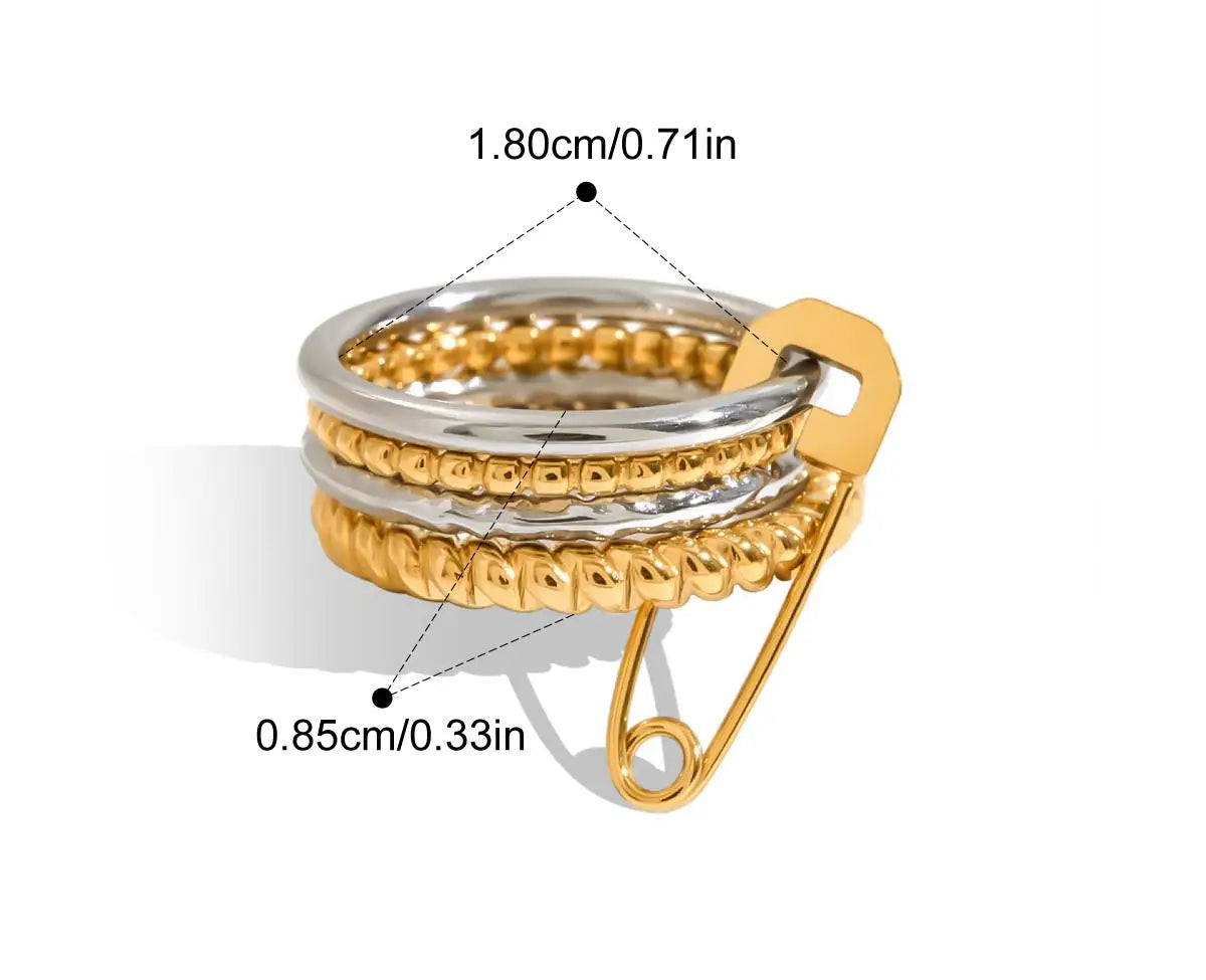  Eine grafische Darstellung eines mehrlagigen Rings mit glatten goldenen und silbernen Bändern und einem goldenen Sicherheitsnadel-Verschluss. Die Maße sind ebenfalls angegeben mit 1,8 cm Innendurchmesser und 0,85 cm Breite