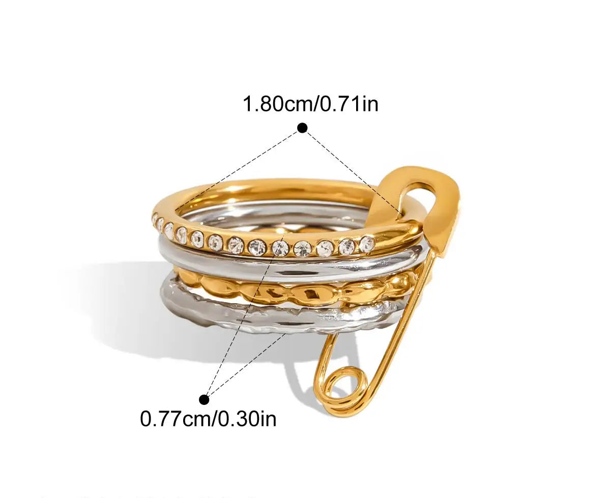  Eine grafische Darstellung eines mehrlagigen Rings mit glatten goldenen und silbernen Bändern und einem goldenen Sicherheitsnadel-Verschluss. Die Maße sind ebenfalls angegeben mit 1,8 cm Innendurchmesser und 0,77 cm Breite