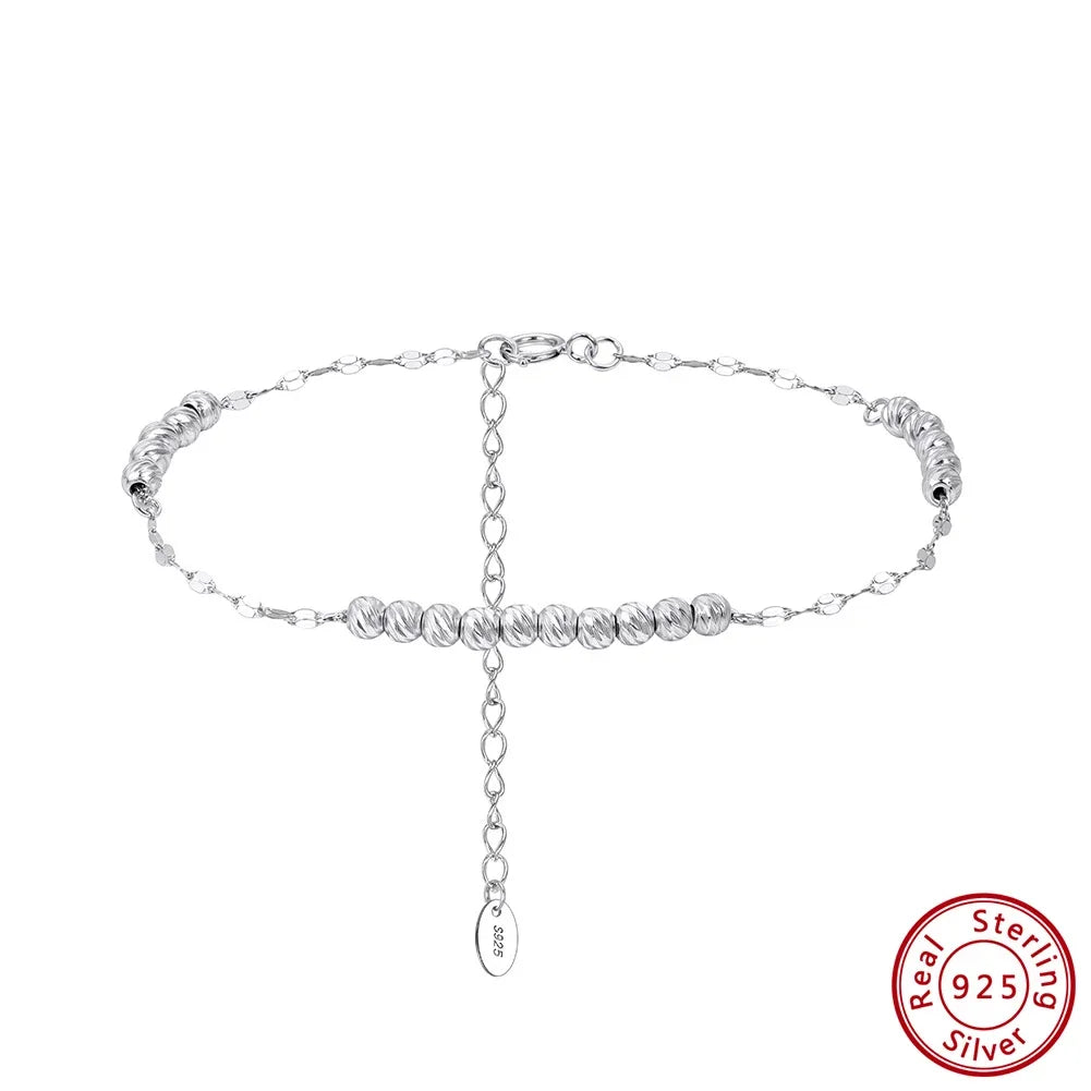 Freigestelltes, silbernes Armband aus 925er Sterling Silber mit kleinen, glänzenden Kügelchen und einer verstellbaren Verlängerungskette. Das 'Real 925 Sterling Silver' Echtheitssiegel ist unten rechts sichtbar.