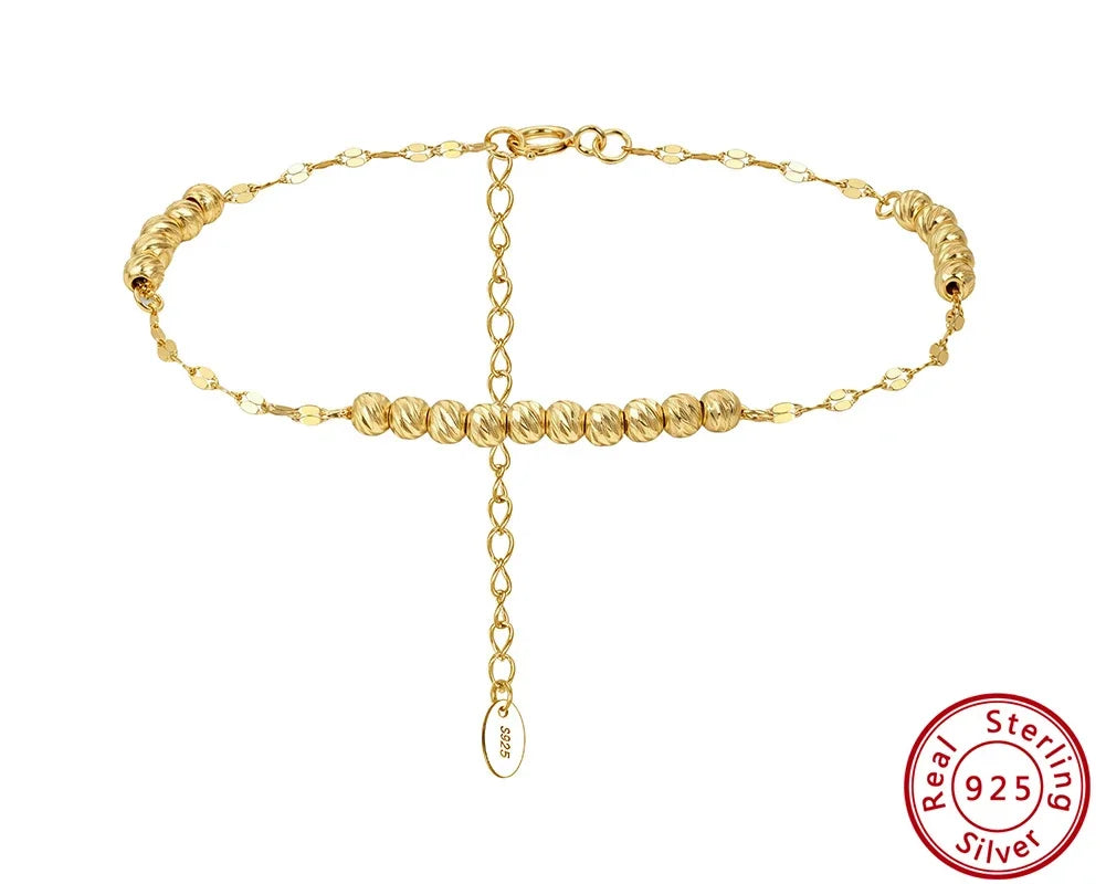 Freigestelltes, goldfarbenes Armband aus 14K vergoldetem 925er Sterling Silber mit feinen Kugeln und einer verstellbaren Gliederkette. Das 'Real 925 Sterling Silver' Echtheitssiegel ist unten rechts sichtbar.