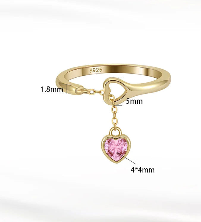 Goldener Ring aus 18K Gold mit rosa Zirkonia-Herzanhänger, Produktdetail mit Größenangaben.